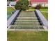 Aerial view of a community's covered shuffleboard courts, providing shaded recreational opportunities at 27003 Racquet Cir, Leesburg, FL 34748