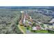 Wide aerial shot of the community, featuring a pool, a lake, and a well-maintained landscape at 2754 Sun Key Pl, Kissimmee, FL 34747