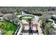 Grand entrance to the community featuring beautiful landscaping, a water feature, and a gated entry at 2754 Sun Key Pl, Kissimmee, FL 34747