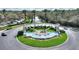 Welcoming entrance to Emerald Island Resort, featuring beautiful landscaping and water fountain at 2754 Sun Key Pl, Kissimmee, FL 34747