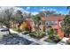 A colorful row of townhomes with palm trees and convenient parking at 2754 Sun Key Pl, Kissimmee, FL 34747