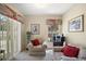 Cozy living room with view of the screened-in pool. Comfortable seating at 2903 Blooming Alamanda Loop, Kissimmee, FL 34747