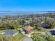 Aerial view of homes, featuring well-maintained lawns, mature trees, and a view of the lake at 2918 Cocovia Way, Leesburg, FL 34748