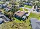 Aerial view showcases the property's layout, including the home, outbuilding, spacious yard, and perimeter boundary at 2918 Cocovia Way, Leesburg, FL 34748