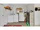 Basement laundry area with washer, dryer, shelving, and additional storage space at 31241 Benton Dr, Eustis, FL 32736