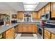 Well-lit kitchen features stainless steel appliances, granite countertops, and bright, neutral cabinets at 31241 Benton Dr, Eustis, FL 32736