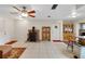 Spacious living room featuring a vintage wood burning stove, tile floors, and natural light at 31241 Benton Dr, Eustis, FL 32736