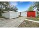 Exterior view of detached sheds with concrete driveway for extra storage or workspace at 31241 Benton Dr, Eustis, FL 32736