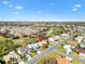 Aerial view of a charming home in a golf course community with lush greenery and well-maintained streets at 3163 Southern Trce, The Villages, FL 32162