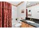 Cozy bathroom featuring shower-tub combination and dark granite vanity at 3163 Southern Trce, The Villages, FL 32162