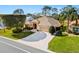 Charming home with a brick paved driveway and lush landscaping create a welcoming curb appeal at 3163 Southern Trce, The Villages, FL 32162