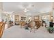 Comfortable living room with plush carpeting, stylish furniture, and natural light at 3163 Southern Trce, The Villages, FL 32162