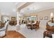 Open-concept living and dining area with neutral tones and plenty of natural light at 3163 Southern Trce, The Villages, FL 32162