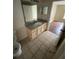 Cozy bathroom featuring tile flooring and a vanity sink at 3417 Westchester Square Blvd # 204, Orlando, FL 32835