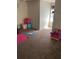 Bedroom with carpet flooring and various items, including a Paw Patrol chair at 3417 Westchester Square Blvd # 204, Orlando, FL 32835