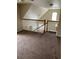 Upstairs carpeted hallway, with railing overlooking the entry at 3417 Westchester Square Blvd # 204, Orlando, FL 32835