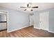 Bedroom with hardwood floors and neutral paint at 35 Sequoia Loop Ct, Ocklawaha, FL 32179