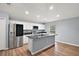 Modern kitchen with stainless steel appliances, granite countertops, and a central island at 35 Sequoia Loop Ct, Ocklawaha, FL 32179