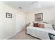 This bedroom features a sofa bed with pillows, carpet flooring, and a white double door closet at 3564 Nomad Ter, The Villages, FL 32163