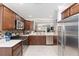 Modern kitchen featuring stainless steel appliances, tile backsplash, and ample counter space at 3564 Nomad Ter, The Villages, FL 32163