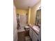 Cozy full bathroom with a tub and single sink at 3629 Maidencain St, Clermont, FL 34714