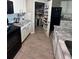 Kitchen featuring white cabinets and a large pantry at 3629 Maidencain St, Clermont, FL 34714