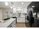 Beautiful updated kitchen featuring new cabinets, quartz countertops and modern stainless-steel appliances at 4614 Eagles Nest Rd, Fruitland Park, FL 34731