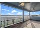 This is a balcony with wood floors and a lake view at 481 Blue Cypress Dr, Groveland, FL 34736