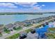 Beautiful waterfront homes with boat docks on a sunny day at 481 Blue Cypress Dr, Groveland, FL 34736