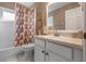 Bathroom featuring tile floors, a tub with shower, and a vanity at 4826 Summerbridge Cir, Leesburg, FL 34748