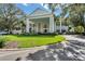 Beautiful two-story clubhouse featuring a grand entrance, mature landscaping, and inviting drive at 4826 Summerbridge Cir, Leesburg, FL 34748