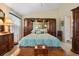 Serene main bedroom featuring a beautiful bed, wooden furniture, and soothing decor at 4826 Summerbridge Cir, Leesburg, FL 34748