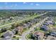 Aerial neighborhood view overlooking tree-lined streets, well-maintained properties, and convenient highway access at 4951 Cypress Hammock Dr, St Cloud, FL 34771