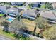 Backyard aerial view featuring lush landscaping, a grassy area, and privacy hedges at 4951 Cypress Hammock Dr, St Cloud, FL 34771