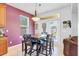 Bright dining area with tiled floors, a modern chandelier, and a dining table with chairs and a bench at 4951 Cypress Hammock Dr, St Cloud, FL 34771