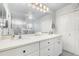 Bathroom featuring a double vanity, large mirror and glass enclosed shower at 5370 Indian Ocean Loop, Tavares, FL 32778