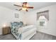 Bedroom with white trim and decorative blue bedding at 5370 Indian Ocean Loop, Tavares, FL 32778