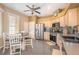 Spacious kitchen area with stainless steel appliances and tile flooring at 5370 Indian Ocean Loop, Tavares, FL 32778