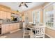 Kitchen featuring a breakfast nook with views from three large windows at 5370 Indian Ocean Loop, Tavares, FL 32778