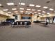 Large, open meeting room with tables, chairs, stage, and projector screen at 5370 Indian Ocean Loop, Tavares, FL 32778