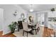 Elegant dining room with chandelier, decor, and seating for six at 54 Pecan Pass, Ocala, FL 34472