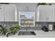 Close up view of modern kitchen sink with stainless steel faucet and subway tile backsplash at 54 Pecan Pass, Ocala, FL 34472