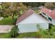 An aerial view of home showcasing the backyard, new roof, and green surroundings at 580 Page Ln, Mount Dora, FL 32757