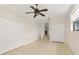 Bedroom with tile flooring, ceiling fan, large closets and natural lighting at 580 Page Ln, Mount Dora, FL 32757