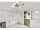 Shed interior with white walls, shelving, and view of the backyard at 580 Page Ln, Mount Dora, FL 32757