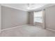 Neutral bedroom featuring carpet, a ceiling fan, and a window with blinds at 589 Sherwood St, The Villages, FL 32162