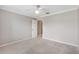 Empty bedroom with neutral walls and door to ensuite bathroom at 589 Sherwood St, The Villages, FL 32162