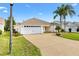 Well maintained home with a two car garage and long driveway at 589 Sherwood St, The Villages, FL 32162