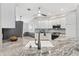 Well-lit kitchen with stainless steel appliances and gray backsplash at 589 Sherwood St, The Villages, FL 32162