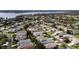 Aerial view of homes in a lakeside community, featuring a bridge to the mainland at 5952 Brittania Blvd, Tavares, FL 32778